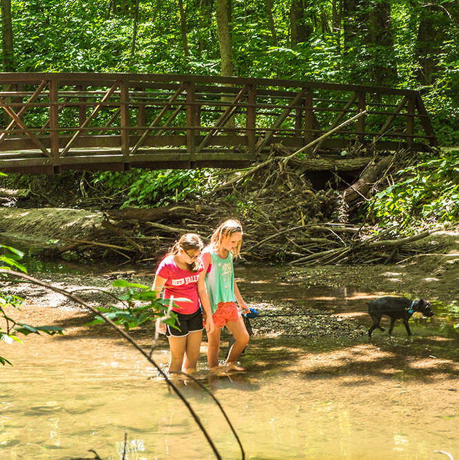 2 girls walking at Flowing Well Park