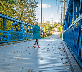 person walking at Greyhound trail in Carmel