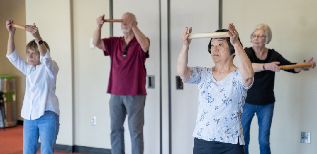 Tai Chi participants practice qigong during a class at the Monon Community Center.