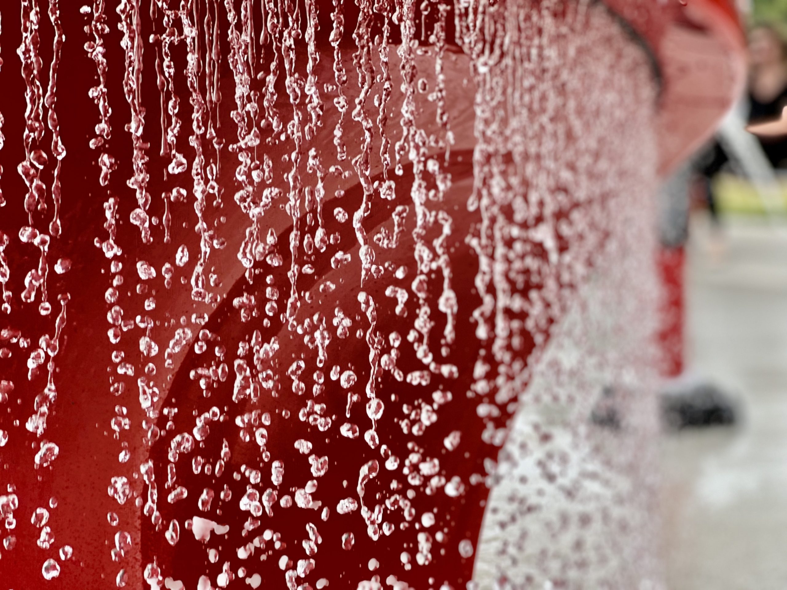 Waterfall flows at Inlow Park splash pad on back of waterslide.