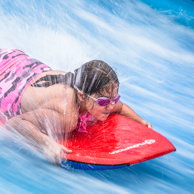 young girl on the FlowRider®