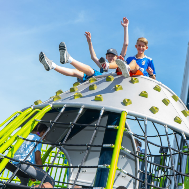 Boys playing on the playground at Chillville summer camp