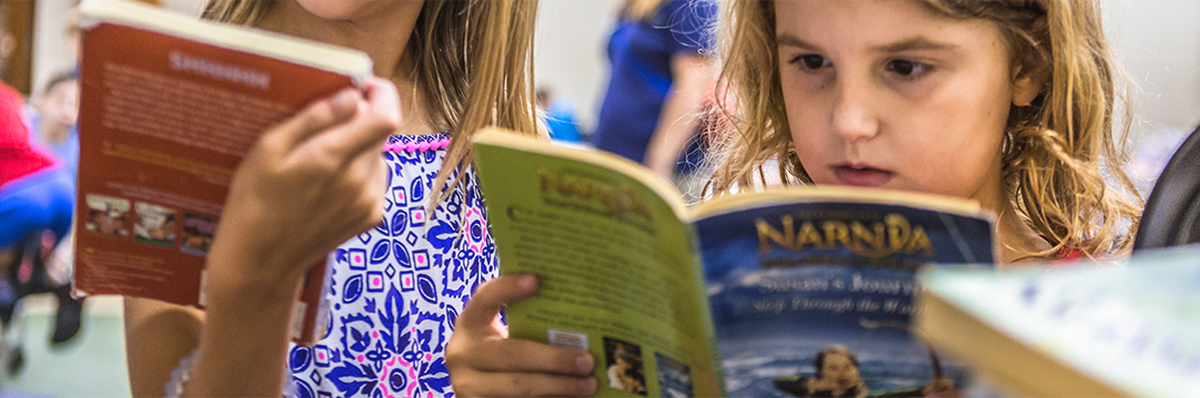 Child reading during Extended School Enrichment Program