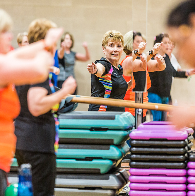 Instructor teaching a sliver sneakers barre class at the Monon Community Center in Carmel