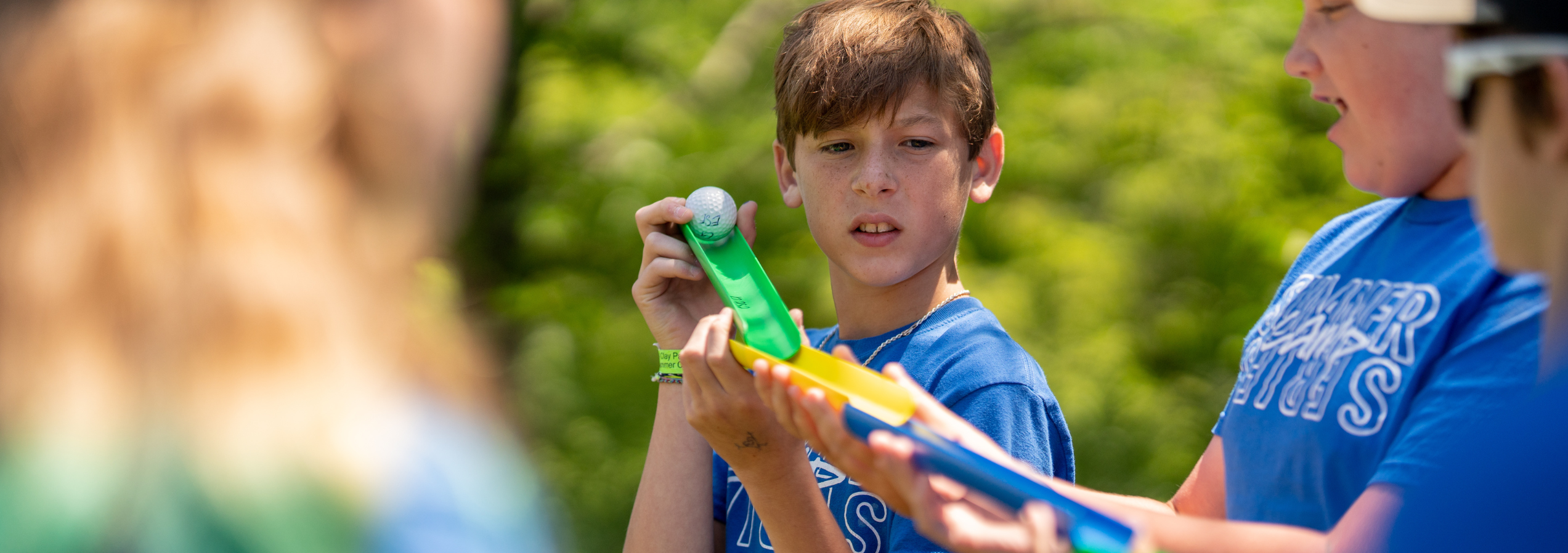 IMPACT campers work together on a team building exercise.