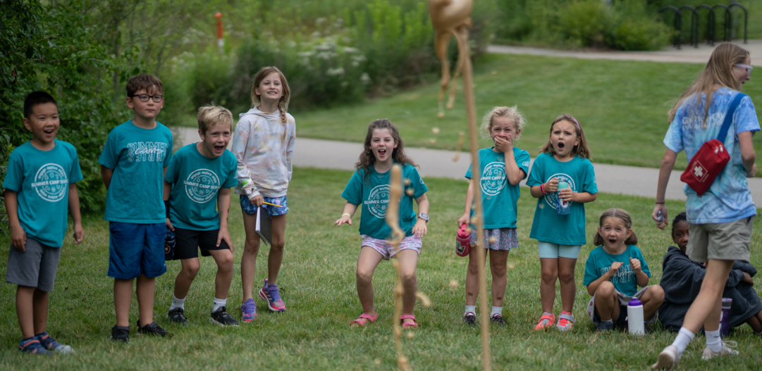 Campers look on in awe as they volcano they created explodes.