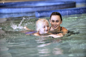 Girl taking swim lessons in the pool at the Monon Community Center (MCC)