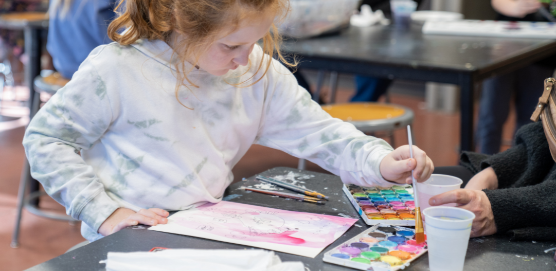 Participant works on water color painting durin an art program at the MCC.