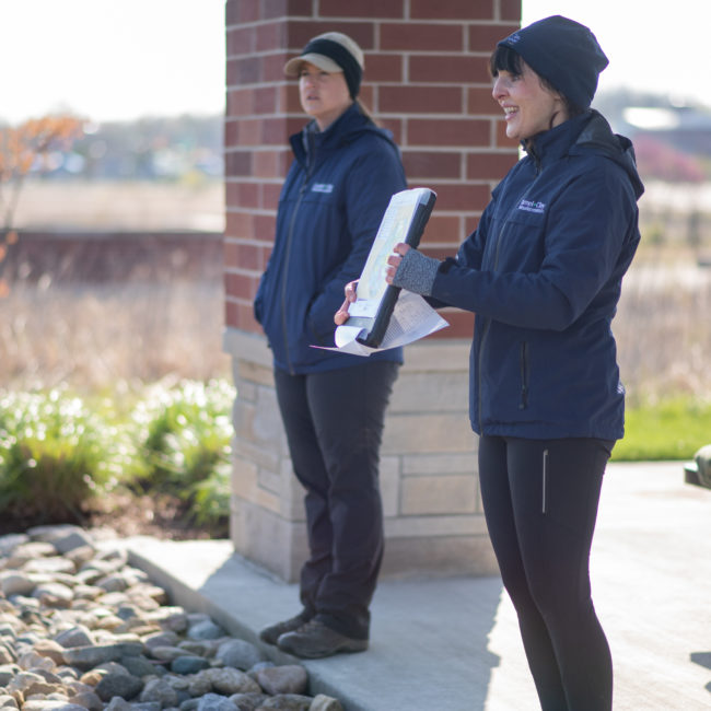 Park volunteer coordinators work at a tree planting event.