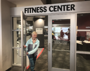 Diana entering the fitness center at the Monon Community Center