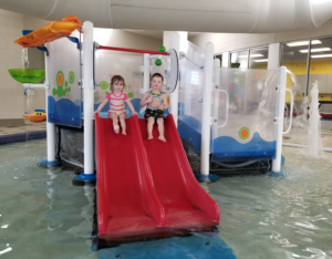 Kids on slides at the indoor pool