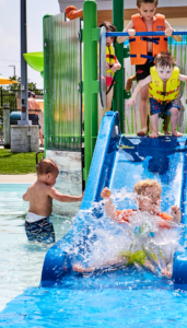 Toddlers playing on the slides at The Waterpark in Carmel