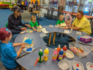 Participants and parents build bird houses during the Knee High Naturalist program. Summer 2019.