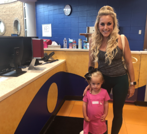 Lindy drops her daughter off at KidZone.