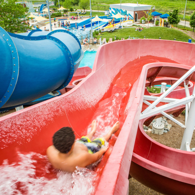 Kid sliding down the adventure slides at The Waterpark