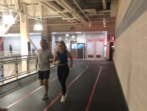 Lindy and Marcus Fischer warming up for a workout on the indoor track at the Monon Community Center.