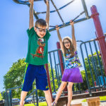 Children playing on monkey bars at Carey Grove Park