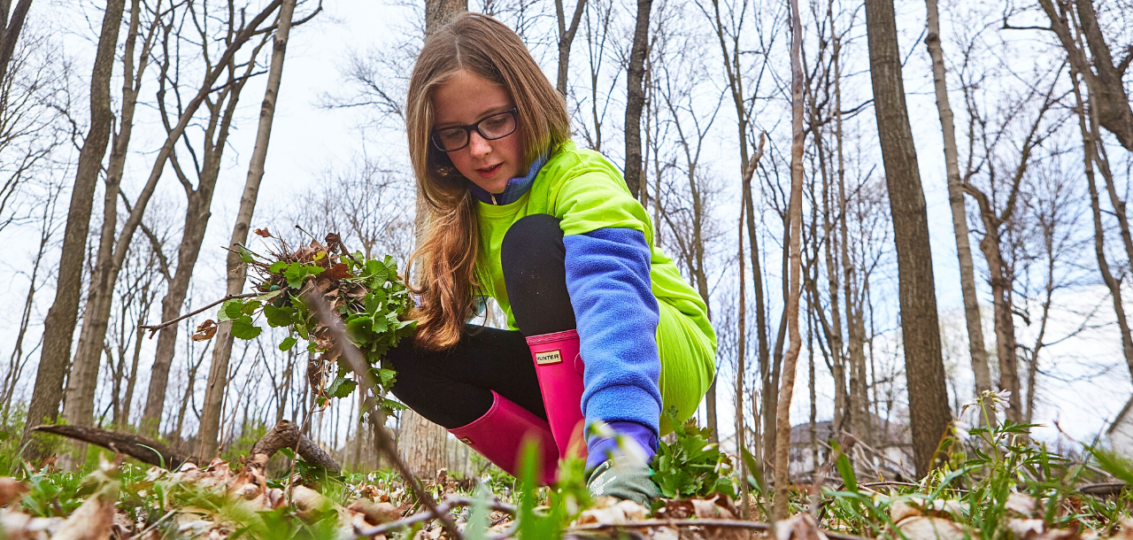 Girl volunteering in a recreation program outside at the park