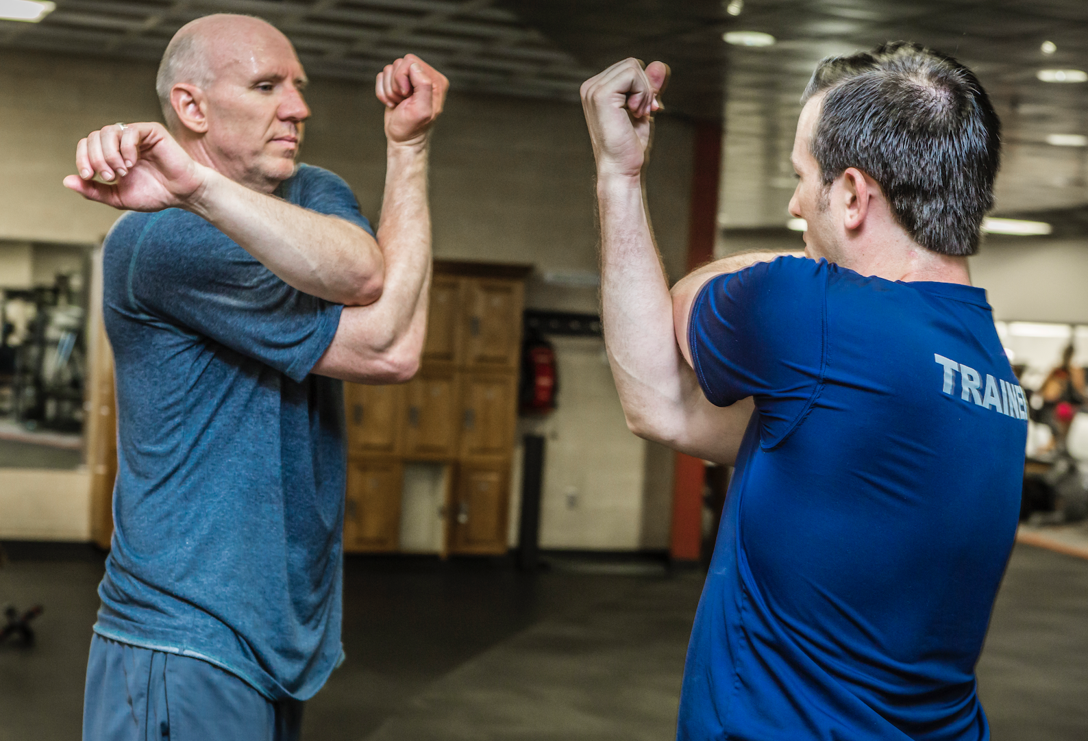 Personal trainer Nate with client in the Fitness Center