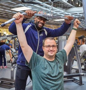 Ryan with his personal trainer at the Monon Community Center