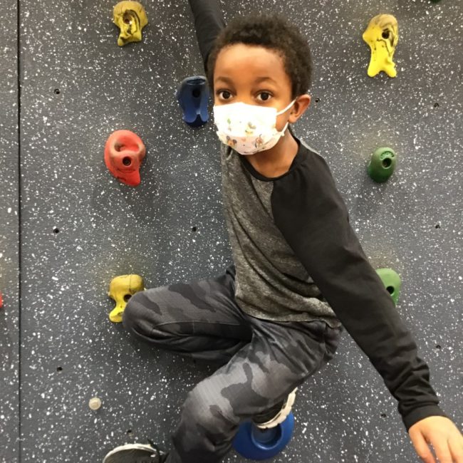 Cherry Tree Elementary ESE student on a climbing wall.