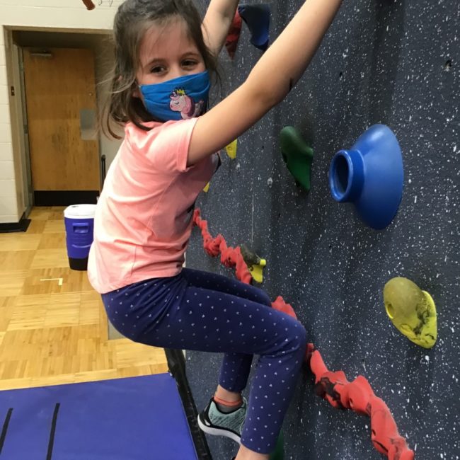 Cherry Tree Elementary ESE student on a climbing wall.