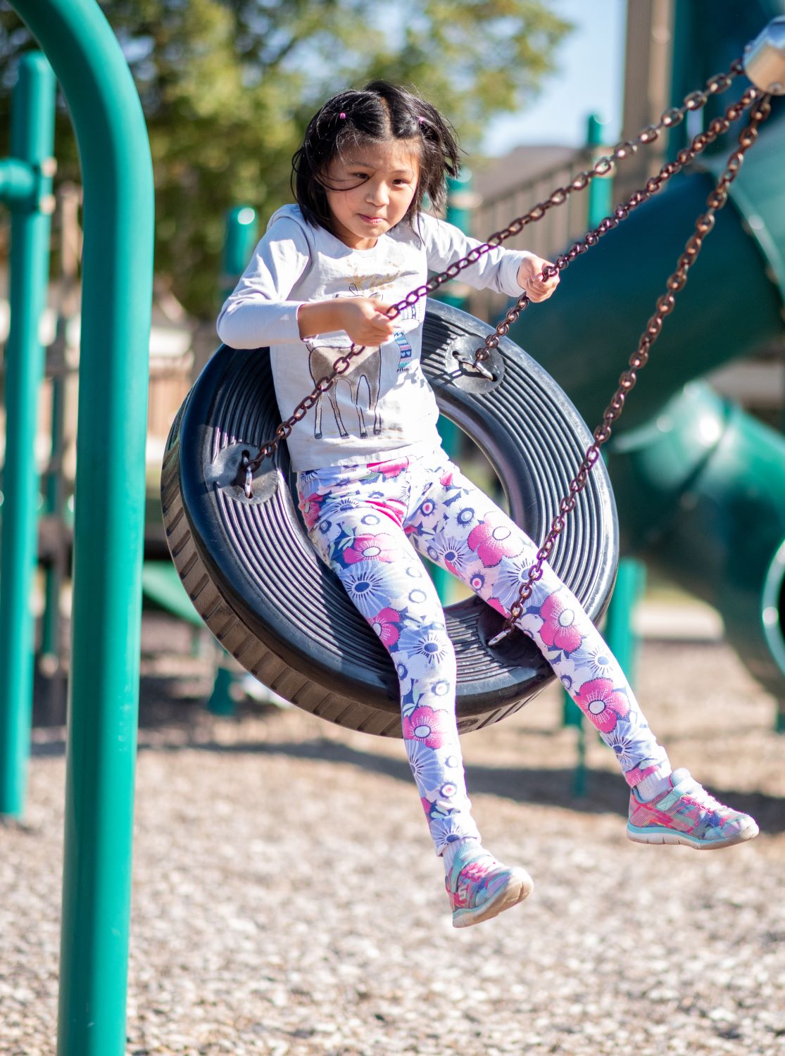 Girl on a tire swing