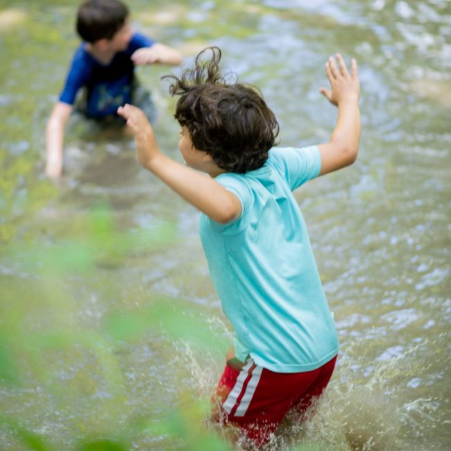 Boys playing in a river