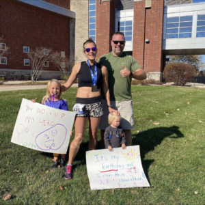 Amanda Luper with her family after finishing the virtual half marathon