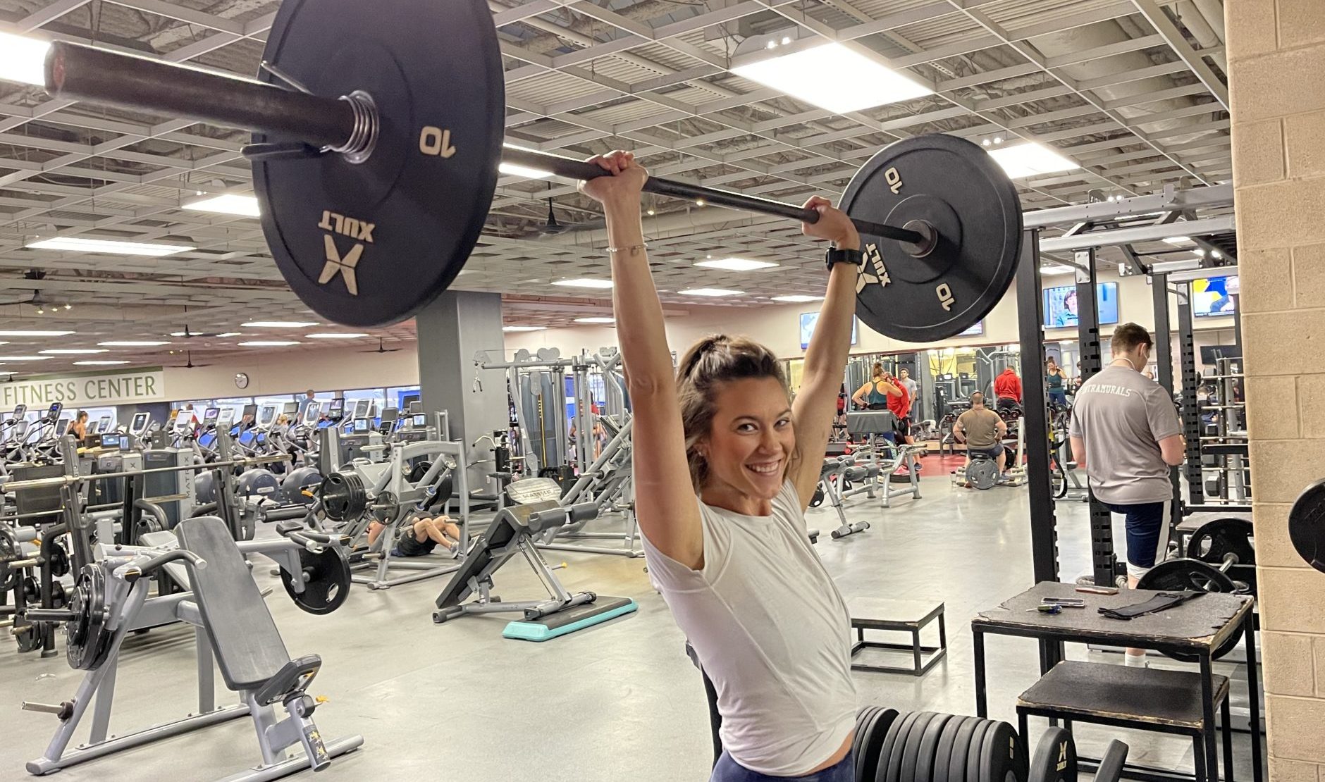 MCC Member Amanda Luper lifting weights in the fitness center