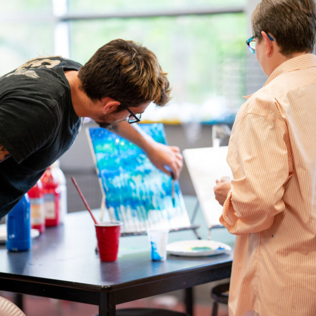 Art Instructor Zach Lowe teaches acrylic pouring