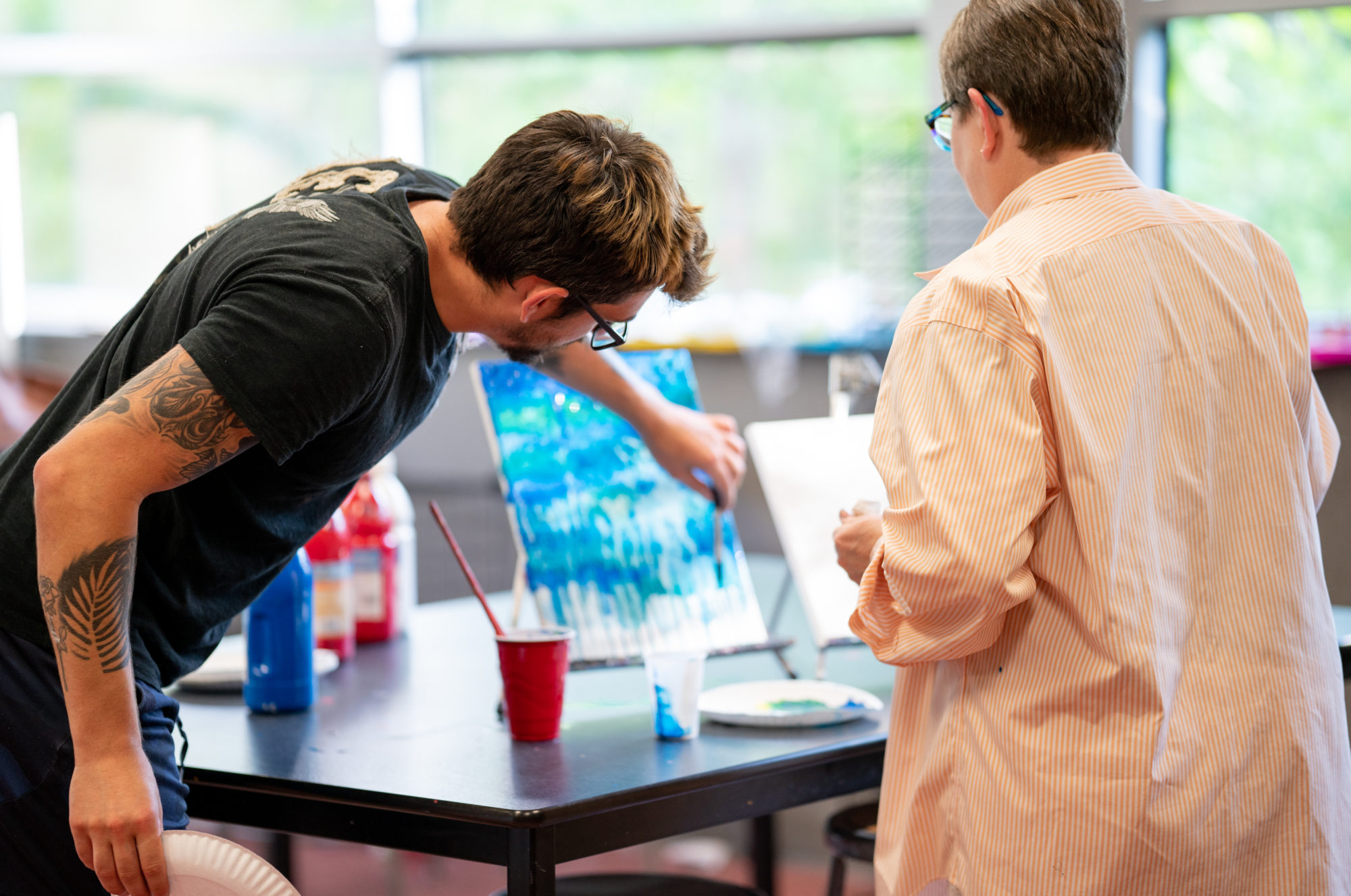 Art Instructor Zach Lowe teaches acrylic pouring