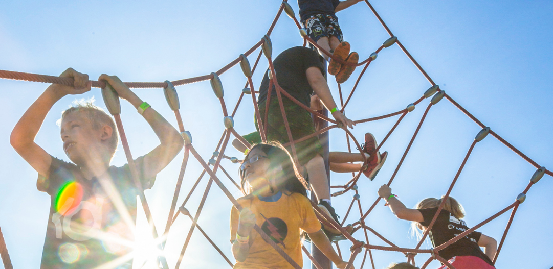 Children playing on climbing structure.