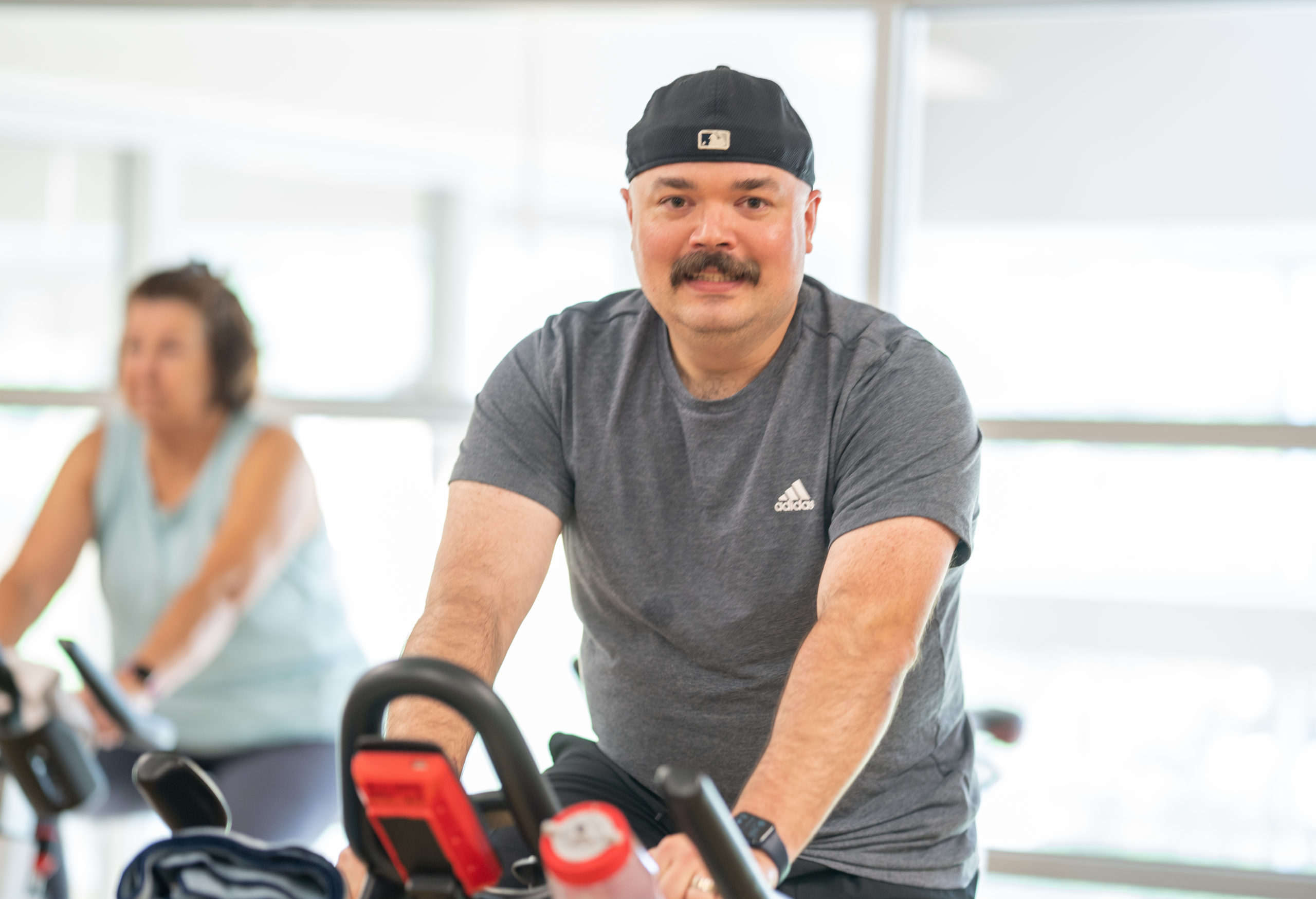 Member Matt P. on spin bike in MCC