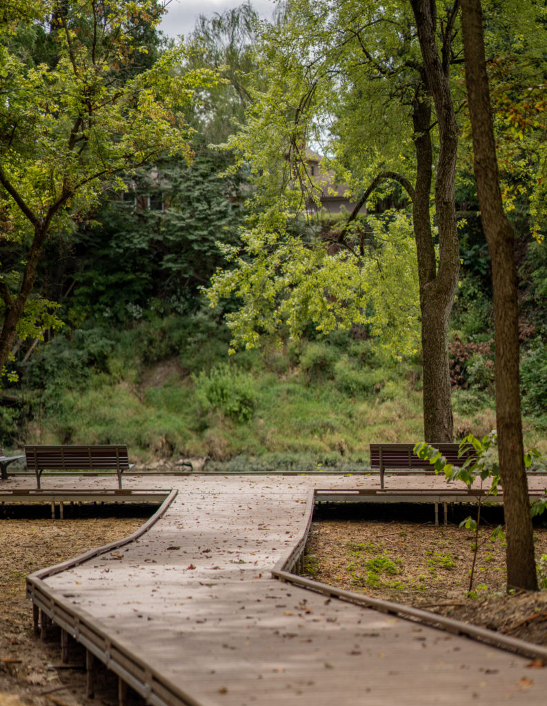 Wheelchair-friendly boardwalks with foot railings for safety lead visitors to the White River's edge for a beautiful and tranquil overlook view at River Heritage Park.