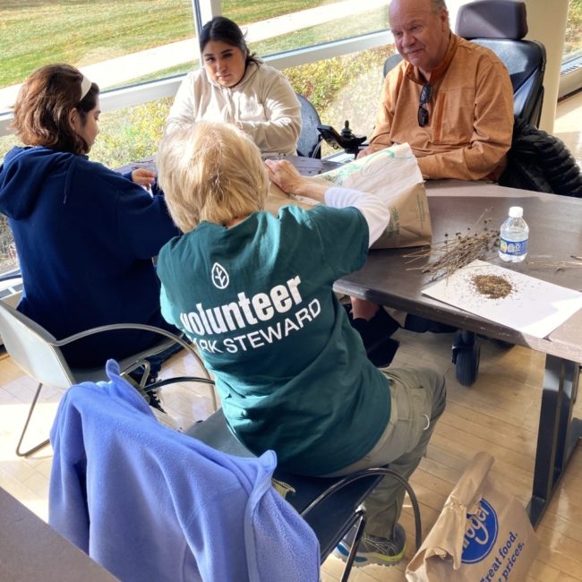 Volunteer seed sorting group.