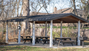 Picnic shelter tucked into the woods at Flowing Well Park