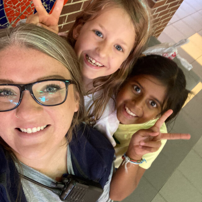 ESE counselor poses for a selfie with two ESE students.