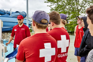 Lifeguards taking courses out at The Waterpark near the slides.