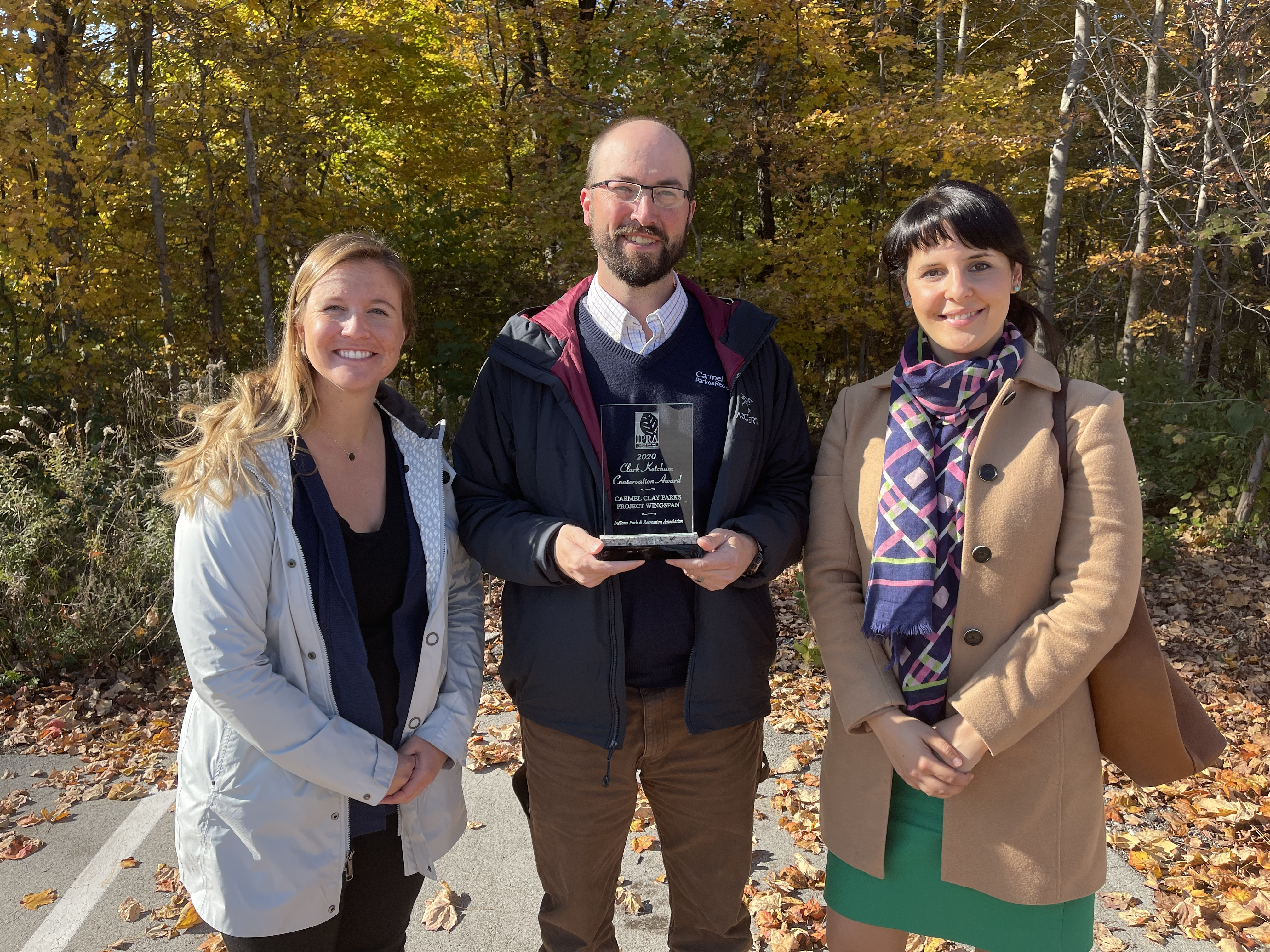 PNR staff smile with the Clark Ketchum award.