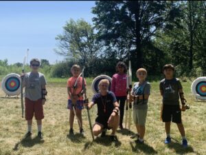 Zachary W teaching archery