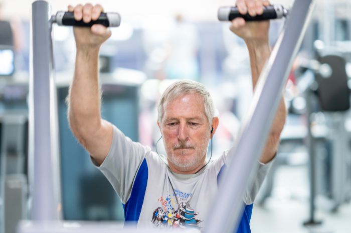 Man strength training at the Monon Community Center. 